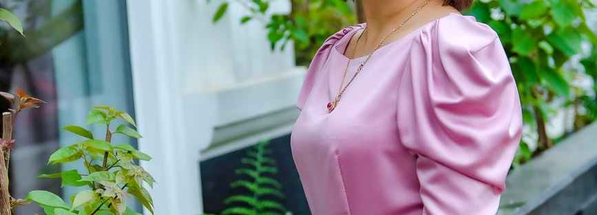 woman in purple dress smiling